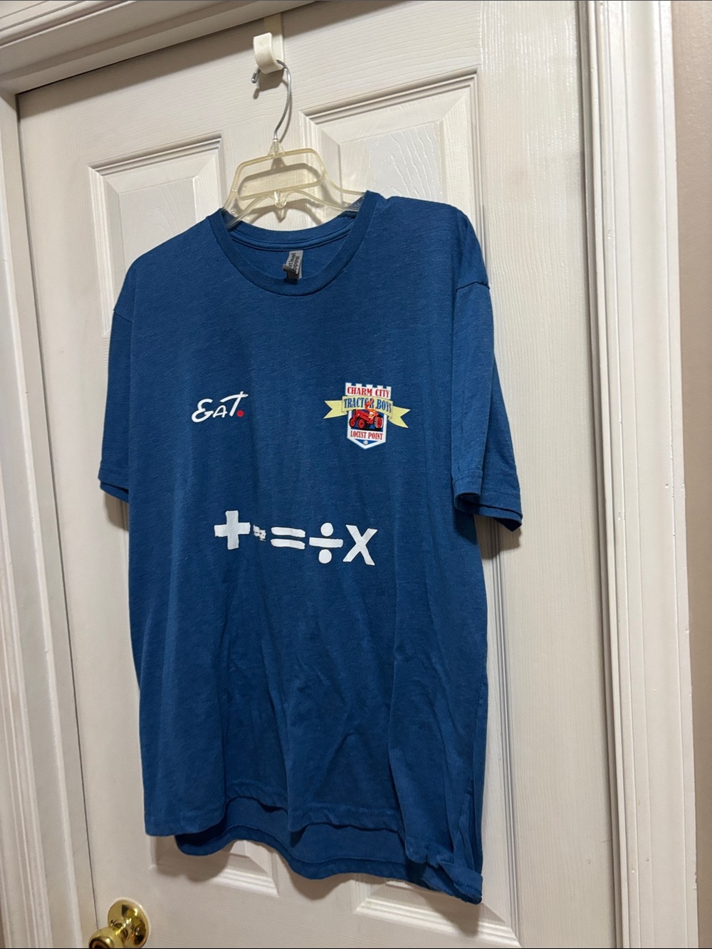 Blue Graphic Tee with Math Symbols and Crest